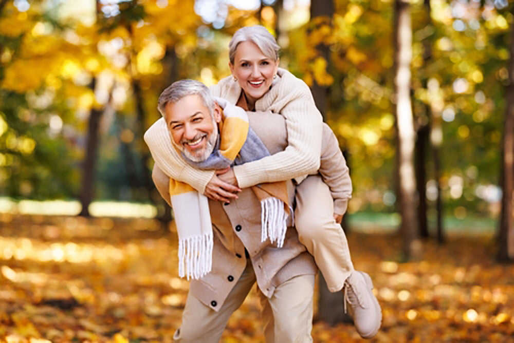 husband giving wife a piggyback